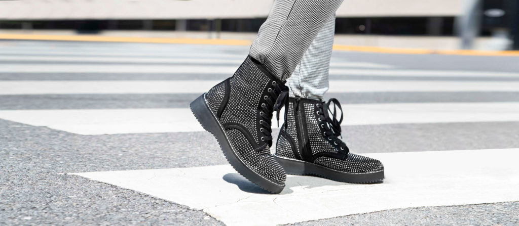Woman wearing combat boots at a crosswalk