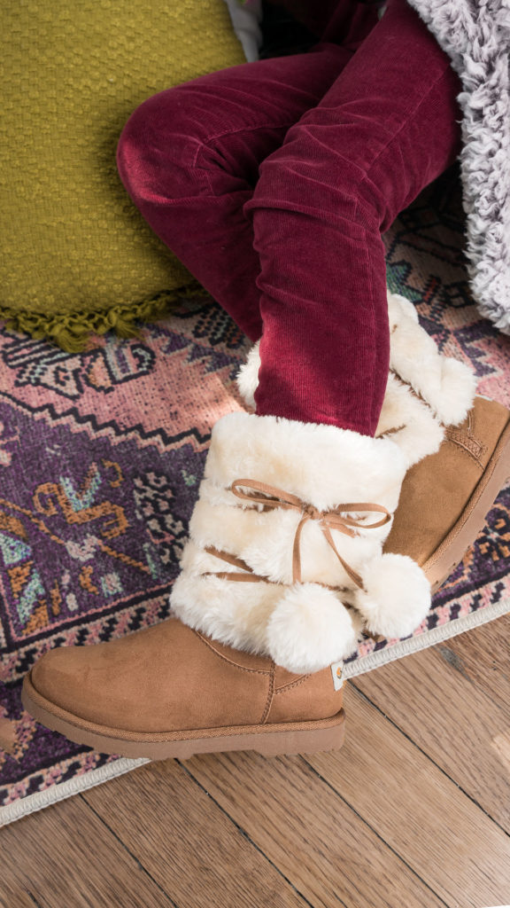 Girl wearing fuzzy warm winter Ugg boots
