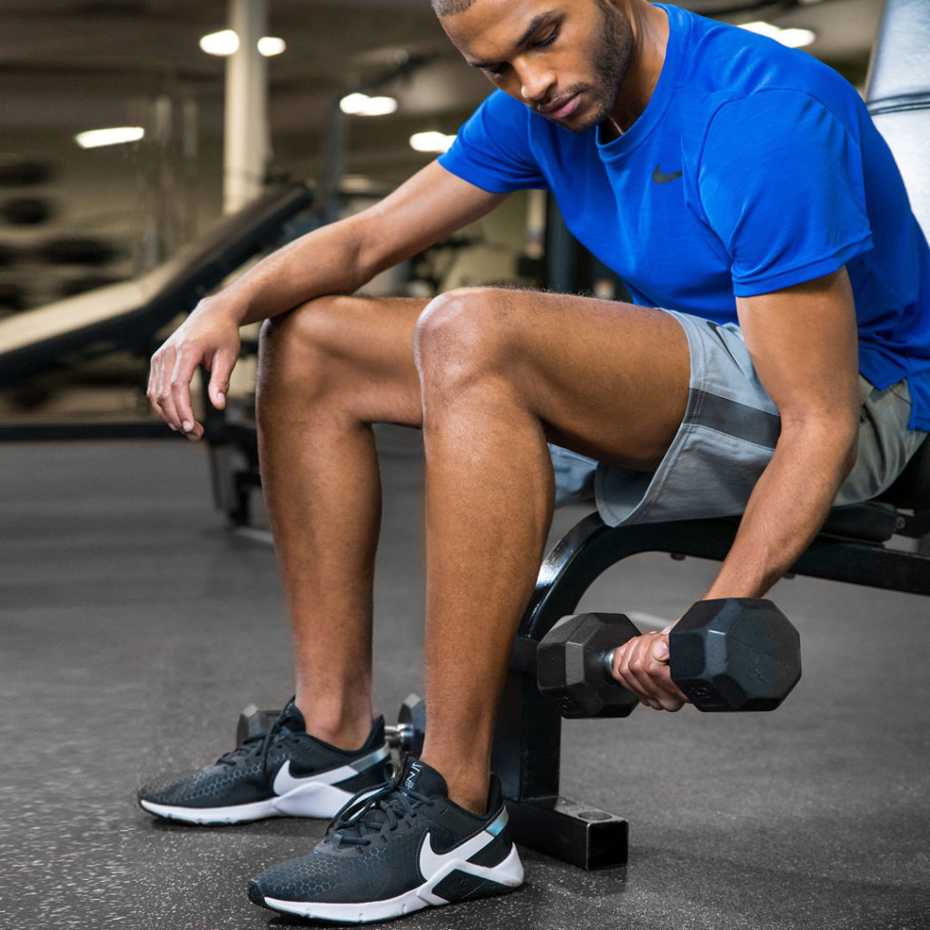 Pumping Iron in the Gym in Men's Nike Legend Essential 2 Cross Training Shoes in Black and White