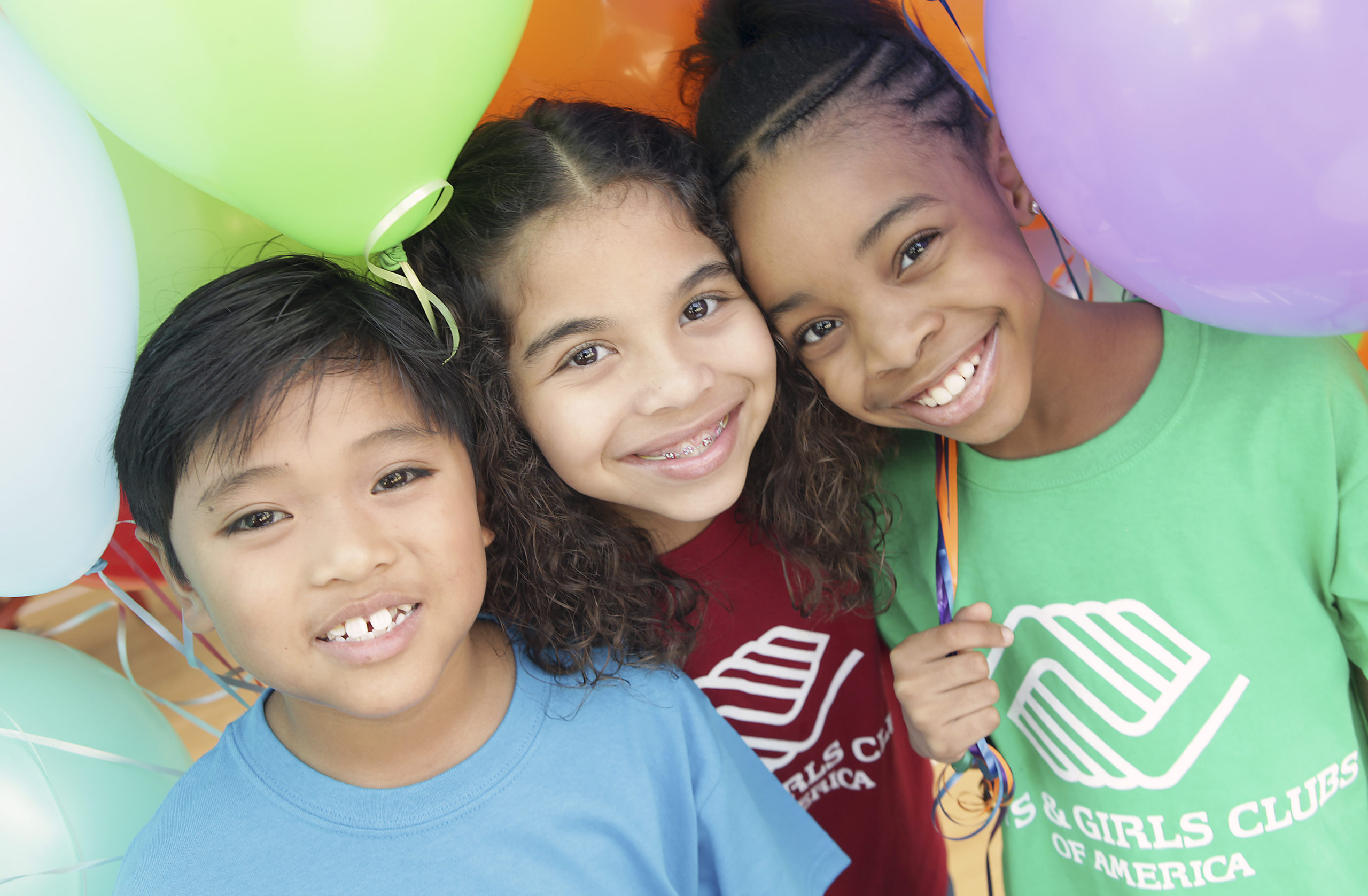 Children wearing Boys & Girls Clubs T-Shirts Smile at a Party